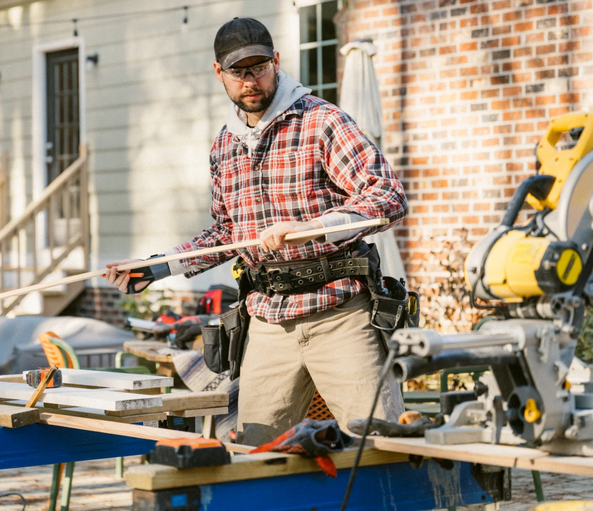 Man working outdoors with carpentry tools