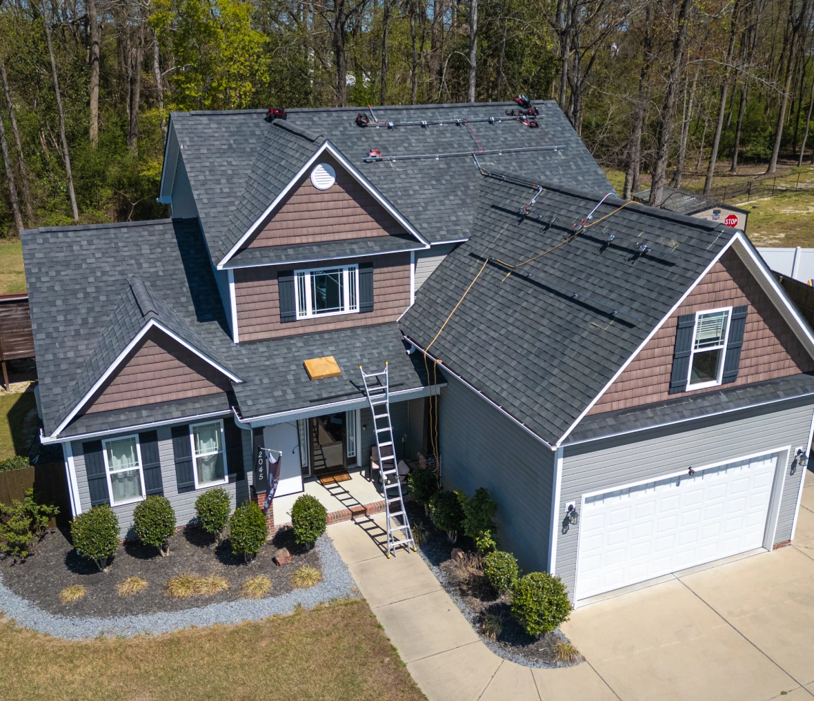 Suburban home with garage and ladder