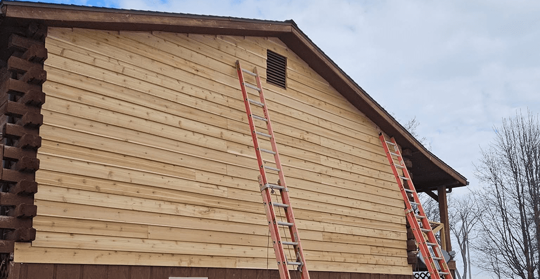 Wooden house with two ladders